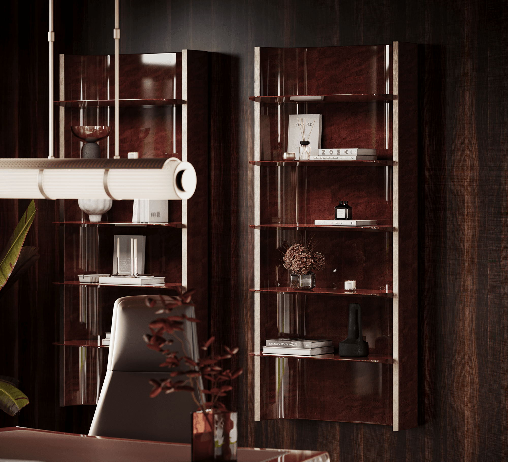 Two high-gloss oxblood shelving units with brushed brass uprights, against a dark eucalyptus wall